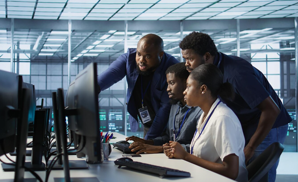 African tech professionals collaborating in a modern office, representing the growing African tech ecosystem.